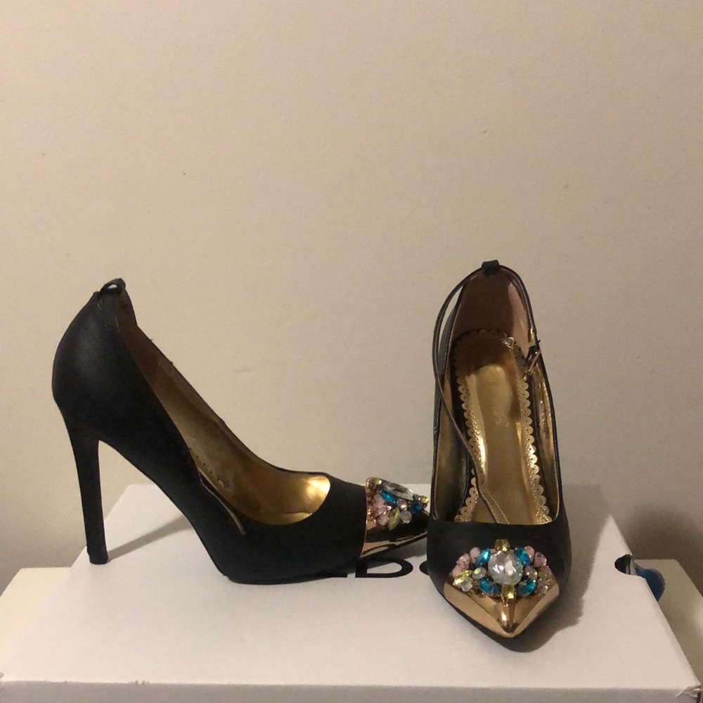 Black heels with an about 4 1/2 inch heel